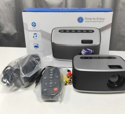 Home cinema projector with remote and accessories, perfect for high-quality image projection. Projectors.