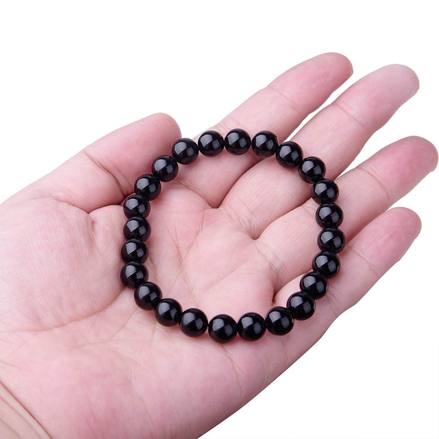 Black Onyx Bracelet displayed on a hand, featuring smooth black agate beads for women.