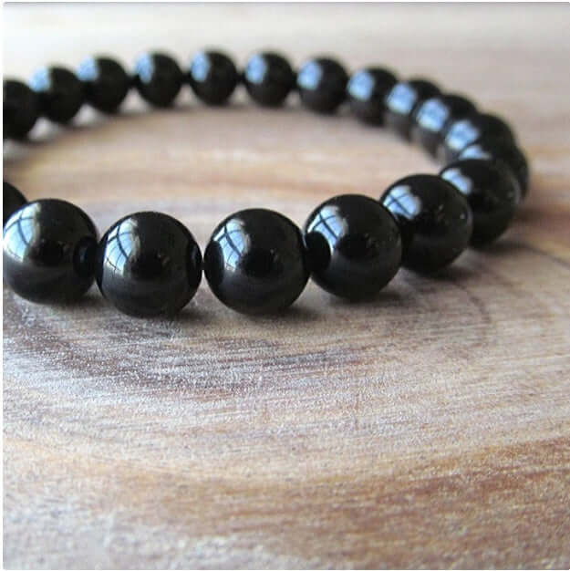Black Onyx Bracelet featuring 8MM black agate beads on an elastic cord, perfect for women.