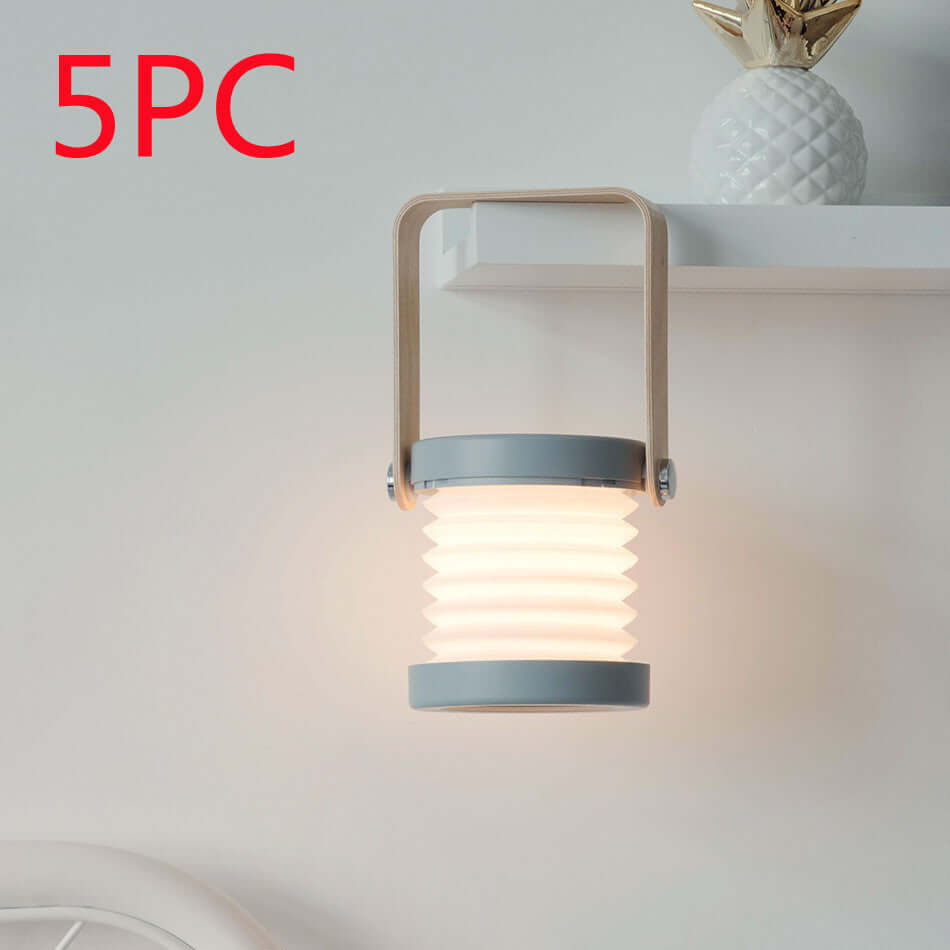 Foldable Touch Dimmable Reading LED Night Light Portable Lantern Lamp USB Rechargeable For Home Decor on shelf.