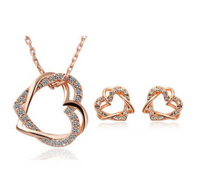 Double diamond heart necklace earring set showcasing exquisite design in rose gold with crystal embellishments.